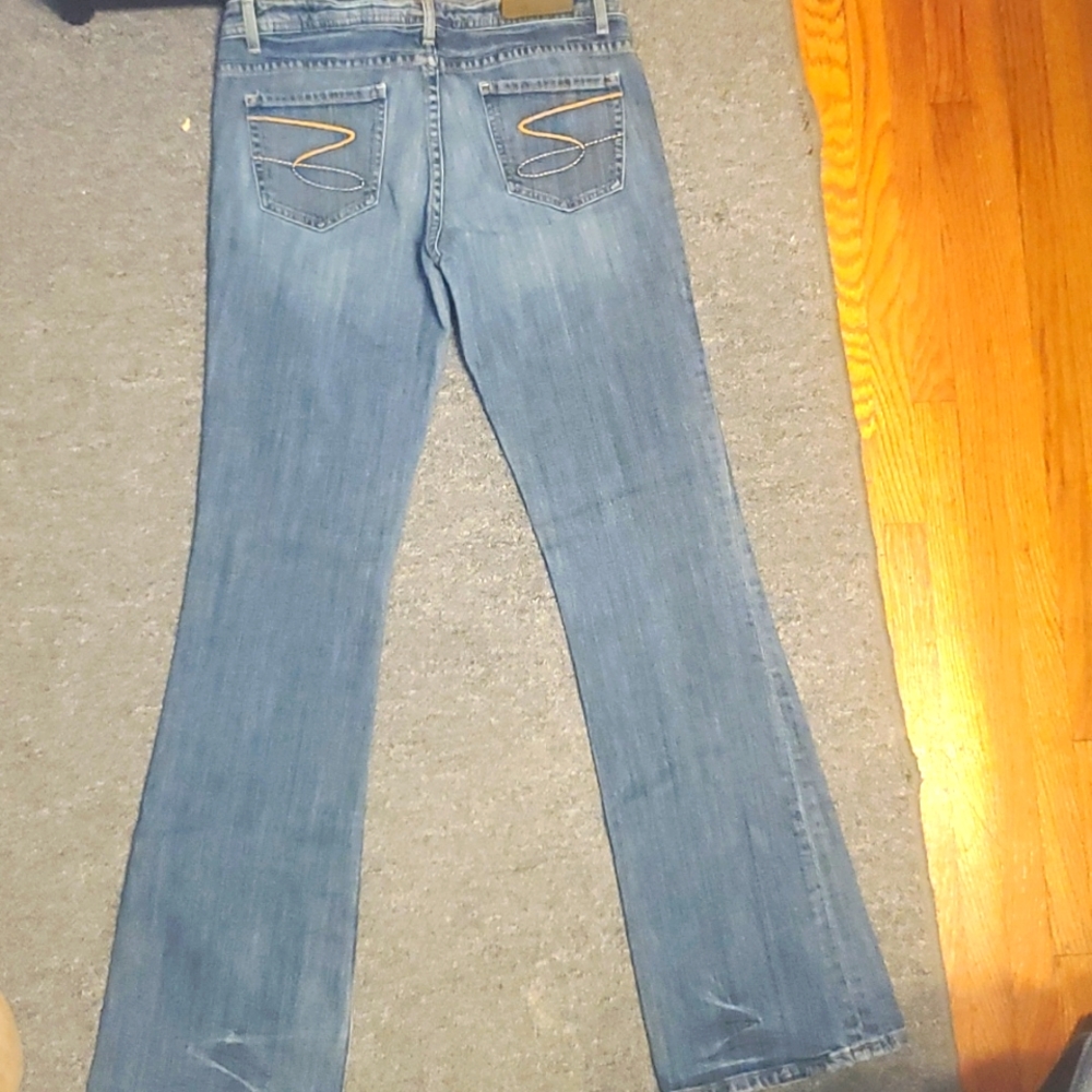 Seven 7 Low Rise Mid Wash Distressed Flare Jeans